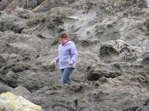 Our daughter checking out the tidal pools for anything to "discover"